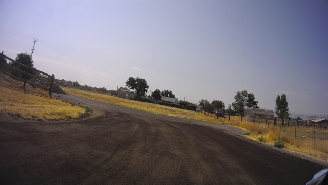 Riding back down the dirt path to get back on the road.