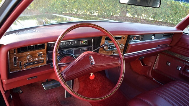 The interior of a 1975 Oldsmobile Delta 88.