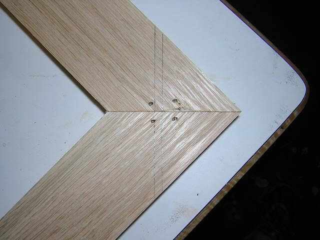 Using brads to clamp biscuit joints.