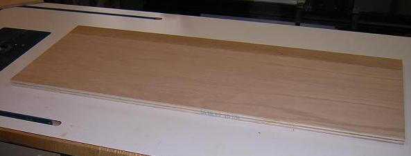 Cutting the rear edging piece to the exact length of the plywood panel.