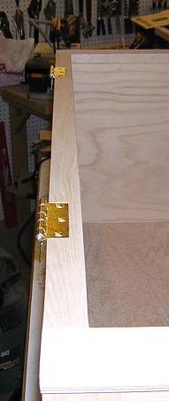 Hinges installed in the mortises on the box.