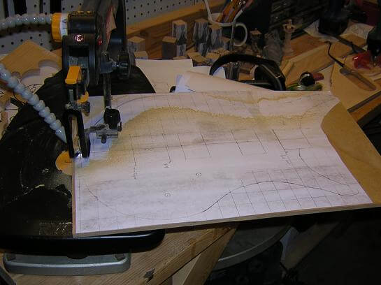 Cutting out the hardboard template on the scroll saw.