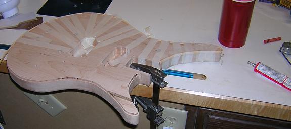 Gluing the binding into place.