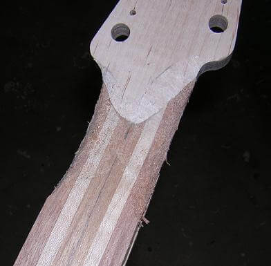 Carving the headstock transition.
