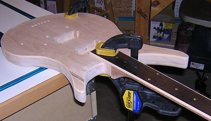 Gluing the neck to the body.