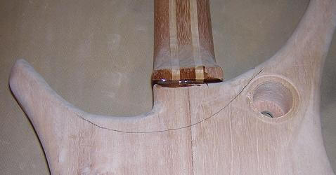 Drawing the pencil line used to guide the neck carving.