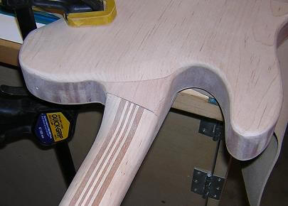 Carving the neck heel.