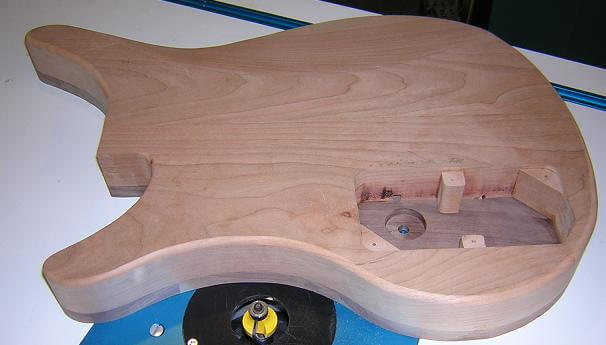 Rounding over the rear edge of the guitar.
