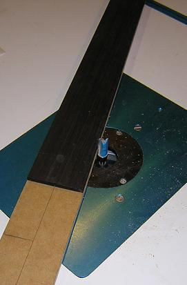 Re-tapeirng the fretboard.
