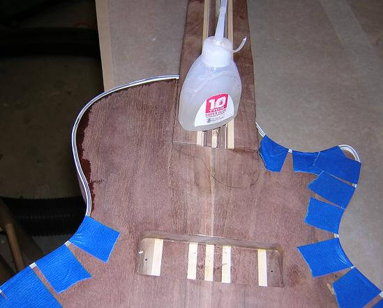 Gluing the binding to the body.