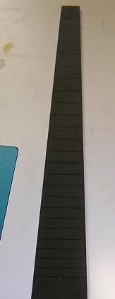 The fretboard tapered to final width.