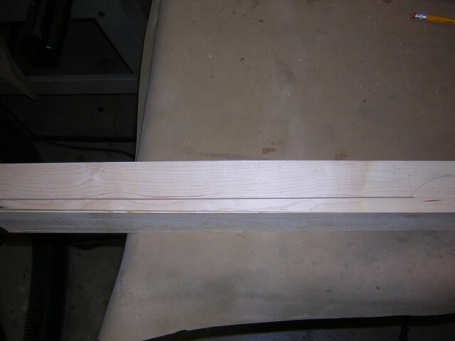 Cutting the body-end of the neck blank to thickness.