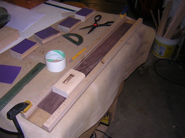 Sanding the compound radius into the face of the neck.