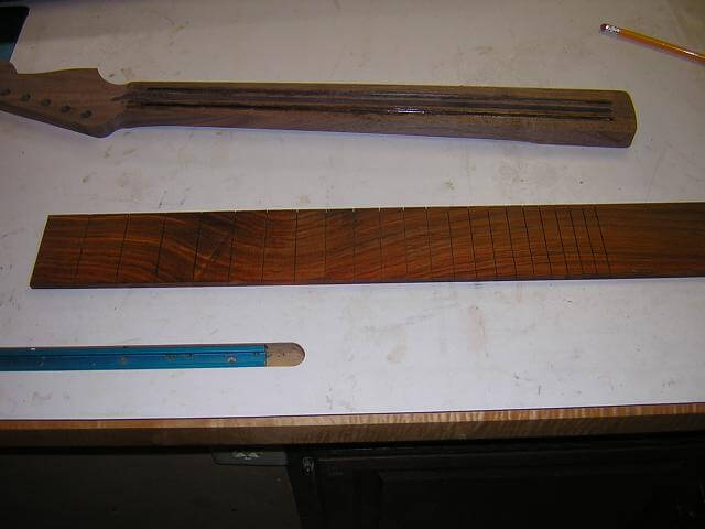 The slotted fretboard.