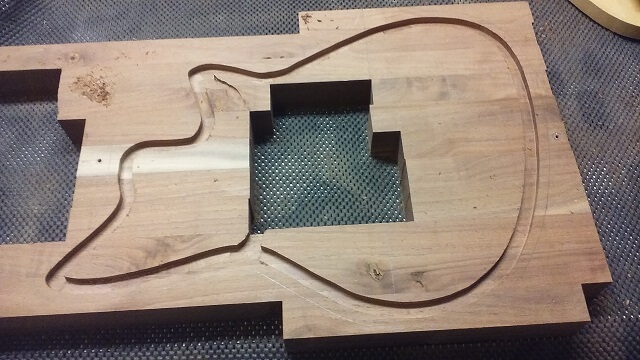 The outline of the top inlay ledge after routing.