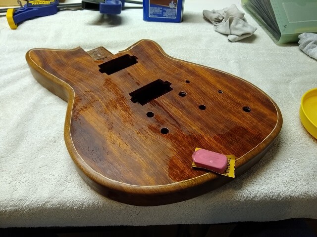 Level sanding the lacquer on the body.
