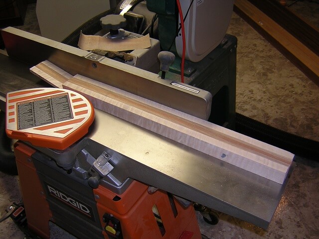 Jointing the face of the neck blank perfectly straight.