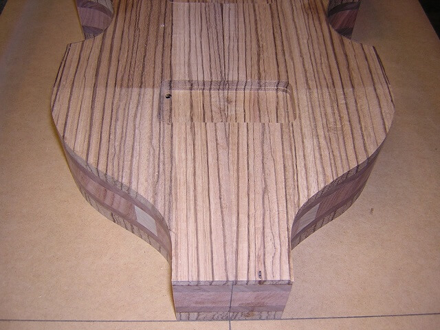 The angled top to provide the proper neck angle.