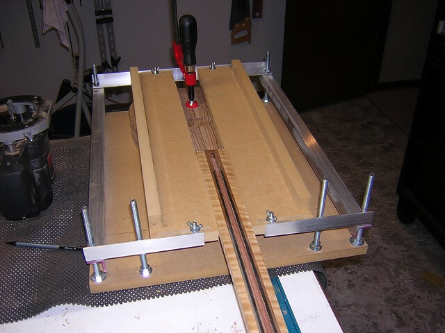 Setting up the jig to route the neck pocket (width).