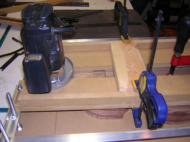 Setting up the jig to route the neck pocket (length).