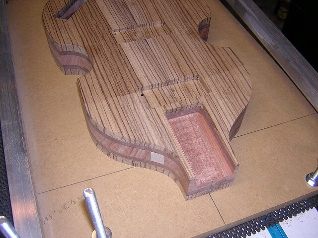The routed neck pocket out of the jig.