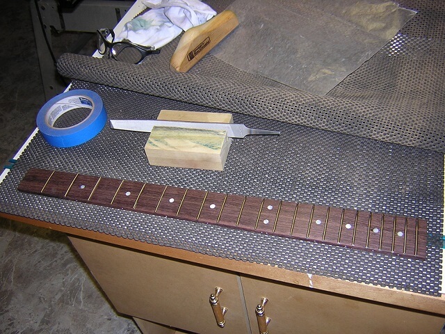 The completed fretboard.