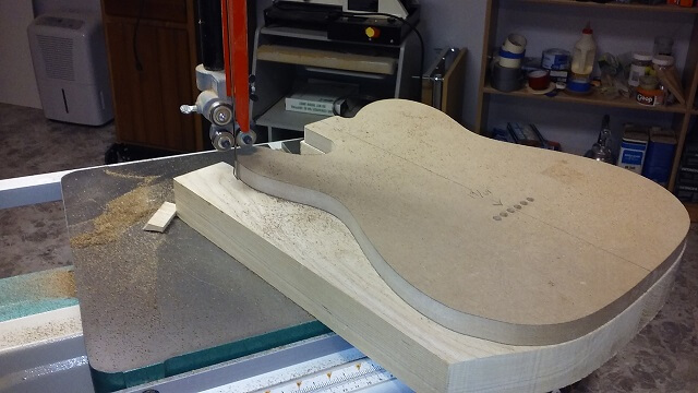 Sawing the body to rough shape.