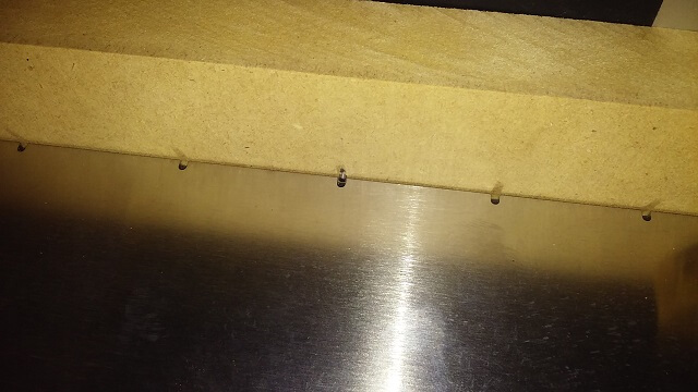 A close-up of the locating pin for the slotting jig.