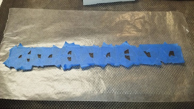 Taping up the fretboard.