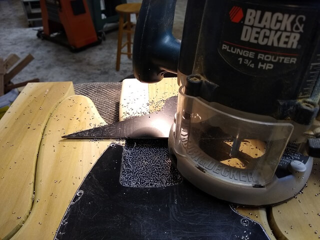 Routing the neck pocket in the pickguard.