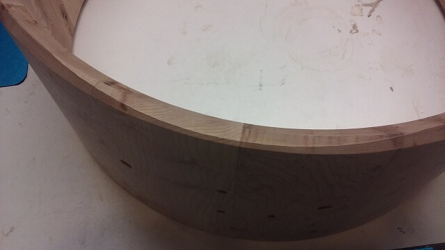 Routing the outside of The flattened bearing edge area in the cut snare bed.
