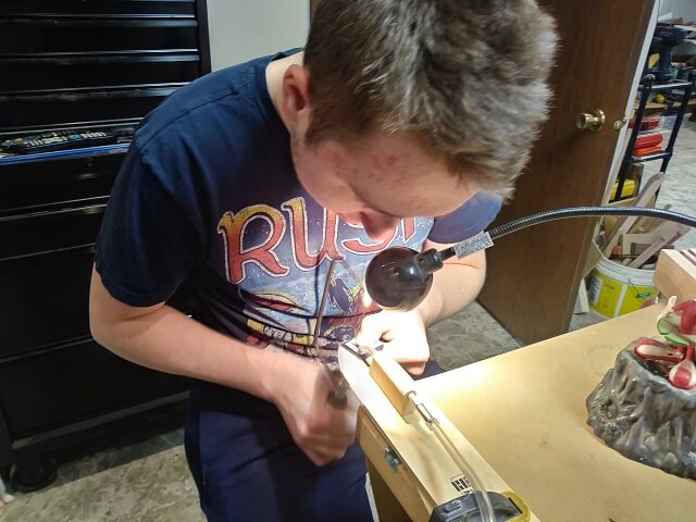 Attempting to cut out a 1st fret inlay that never happened.