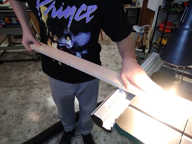 Cutting strips of maple that will get glued on to the neck blank to widen it.