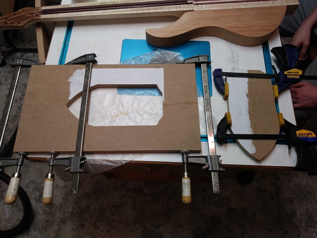 Gluing together the two halves of the front inlay templates.