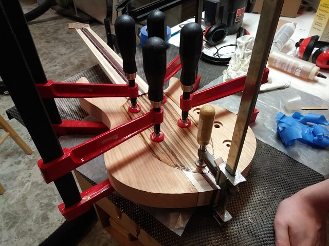 Gluing the front zebrawood inlay in place.