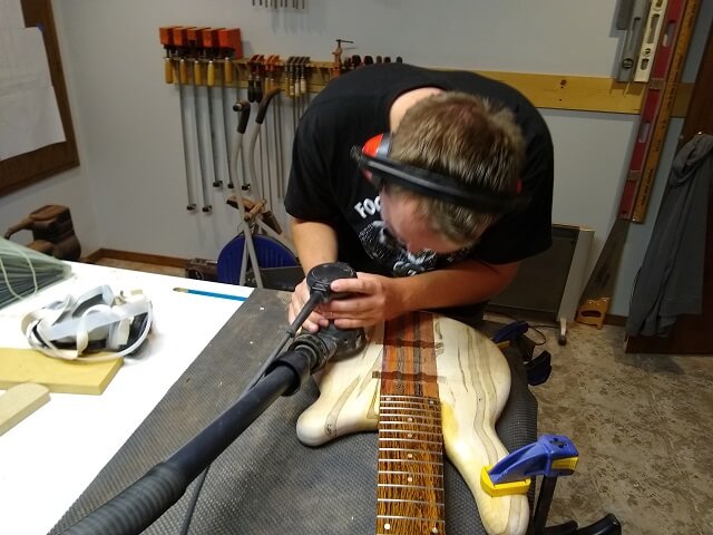 Sanding the front of the bass.