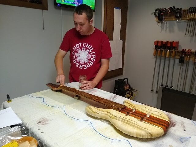 Putting another coat of shellac on the bass.