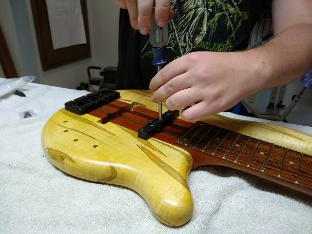 Installing the neck pickup.