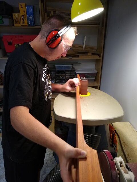 Sanding the back of the neck.