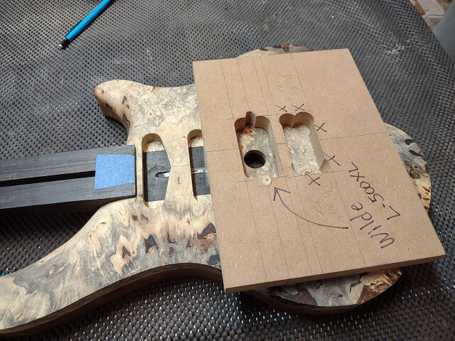Attaching the bridge pickup routing template.