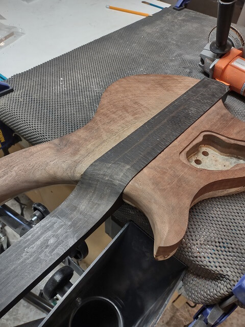Beginning to carve the neck heel.