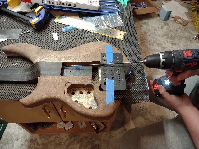 Drilling for the tremolo spring claw screws.