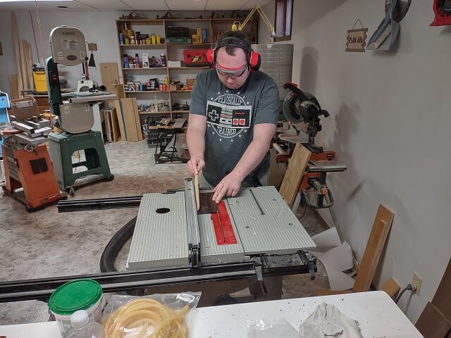 Cutting the tremolo cavity cover to size.