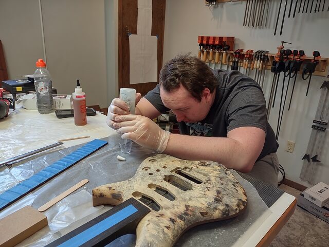 Mixing up the epoxy used to glue the fretboard.