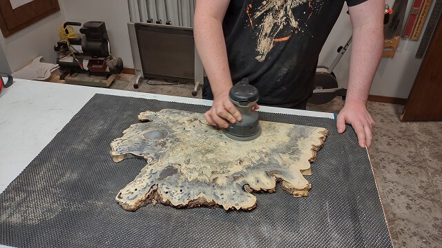 Removing the deep scratches left by the drum sander.