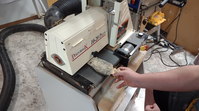 Sanding the veneers to final thickness at the drum sander.