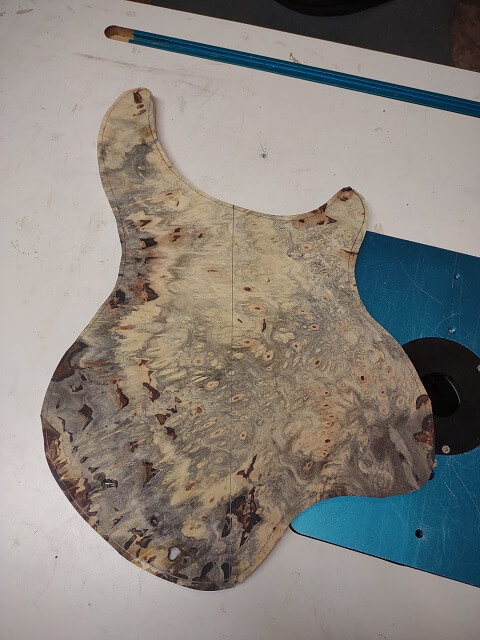 The rough body shape cut from the larger piece of buckeye.