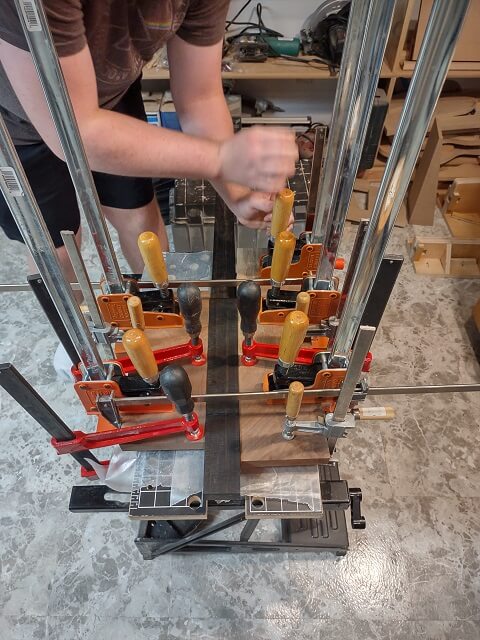 Clamping the top to the wings, with the neck in place as an alignment guide.
