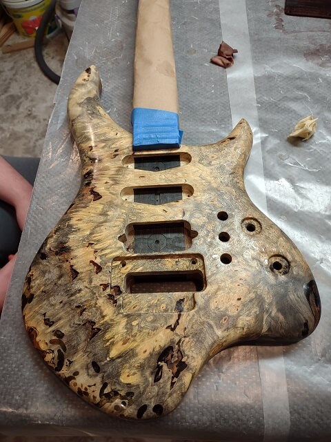The fully shellaced guitar top.