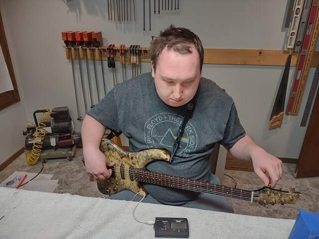 Setting the guitar up.